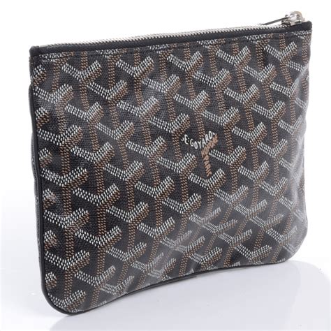 Pochettes Goyard femme .